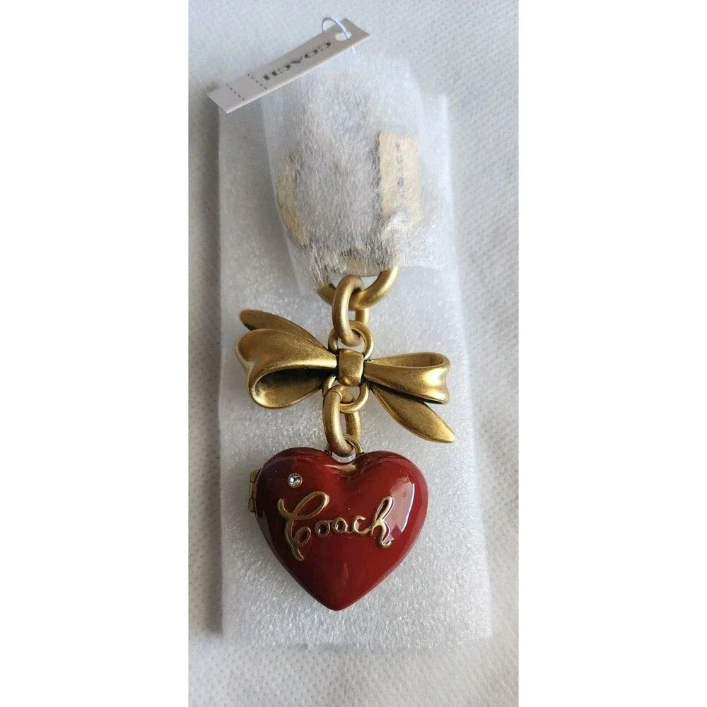 Coach CZ276 Bow Heart Locket Bag Charm-Brass/Ruby